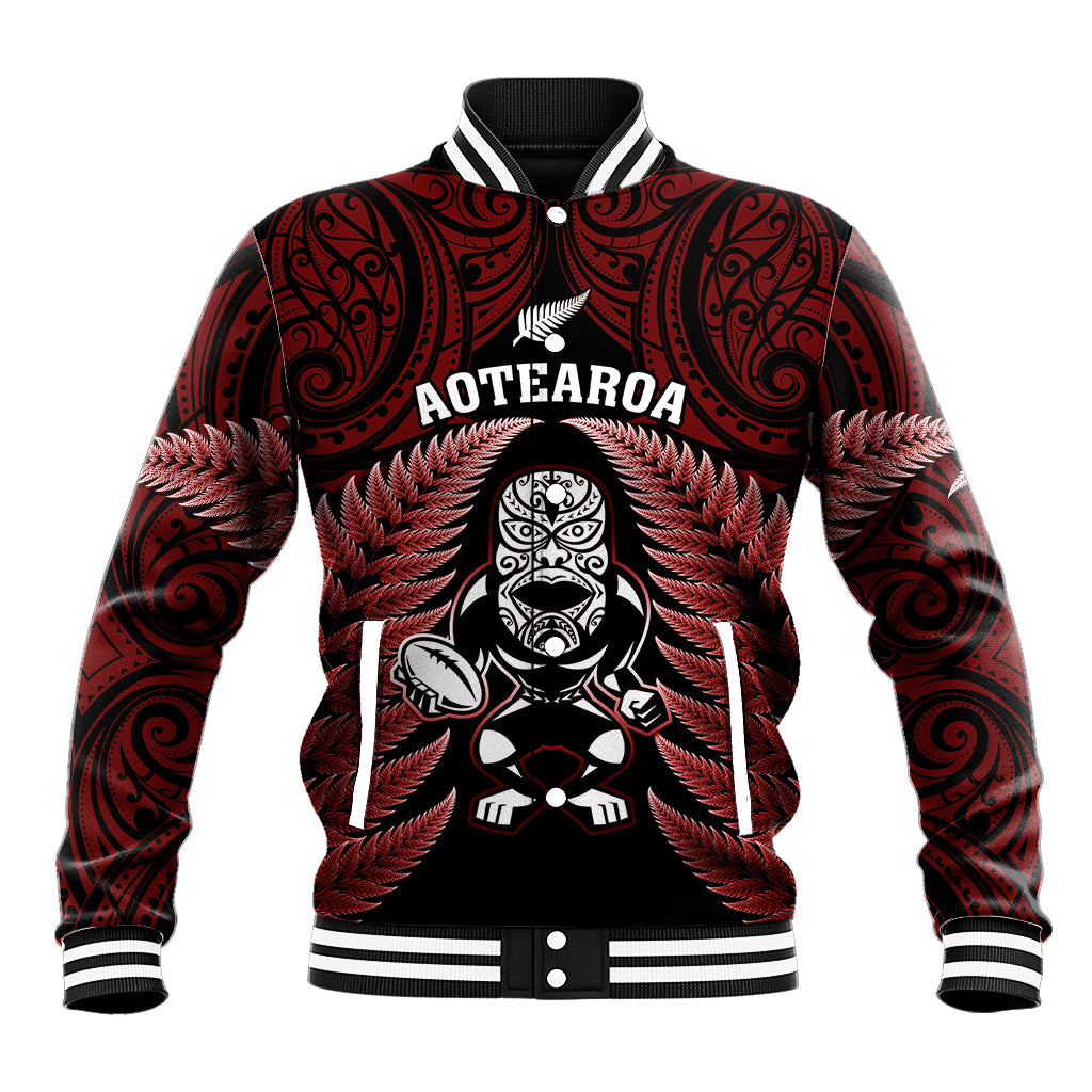 Unisex red-and-black rugby baseball jacket with tiki crest graphic and fern pattern