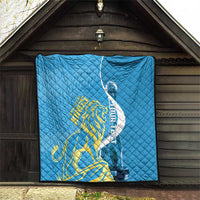 Blue quilt blanket with Saint Lucia Kings gold lion and oval logo, edge border detail