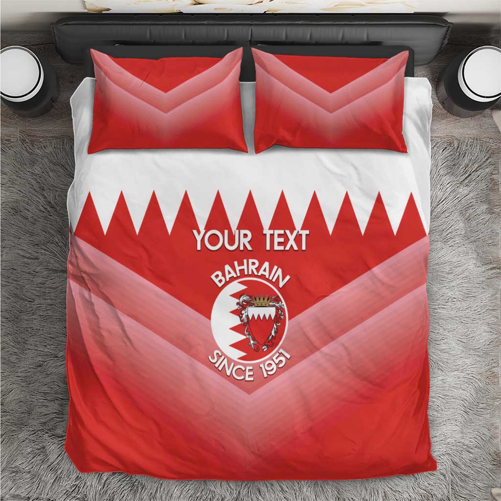 Top-down view of red and white Bahrain-themed football bedding set with duvet and two pillows.