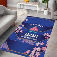 Blue area rug with pink cherry blossoms, hexagon frame, and text: YOUR TEXT, JAPAN, BRAVE BLOSSOMS.
