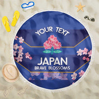 Blue round beach blanket with white fringe, floral Japan print and 'YOUR TEXT' header