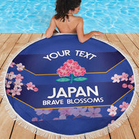 Blue round beach blanket with white fringe, centered Japan Brave Blossoms floral artwork