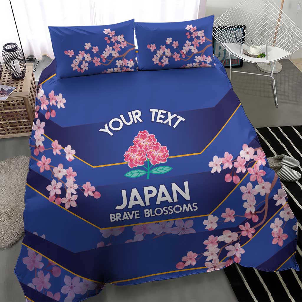 Blue duvet and two pillowcases bedding set with pink cherry blossom and yellow border