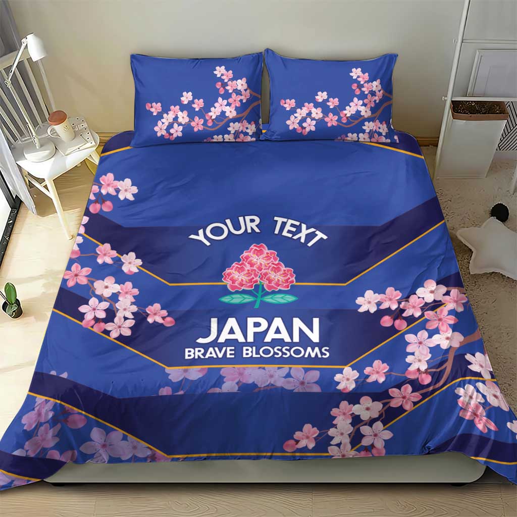 Blue bedding set with duvet and two pillowcases, pink cherry blossom and yellow trim