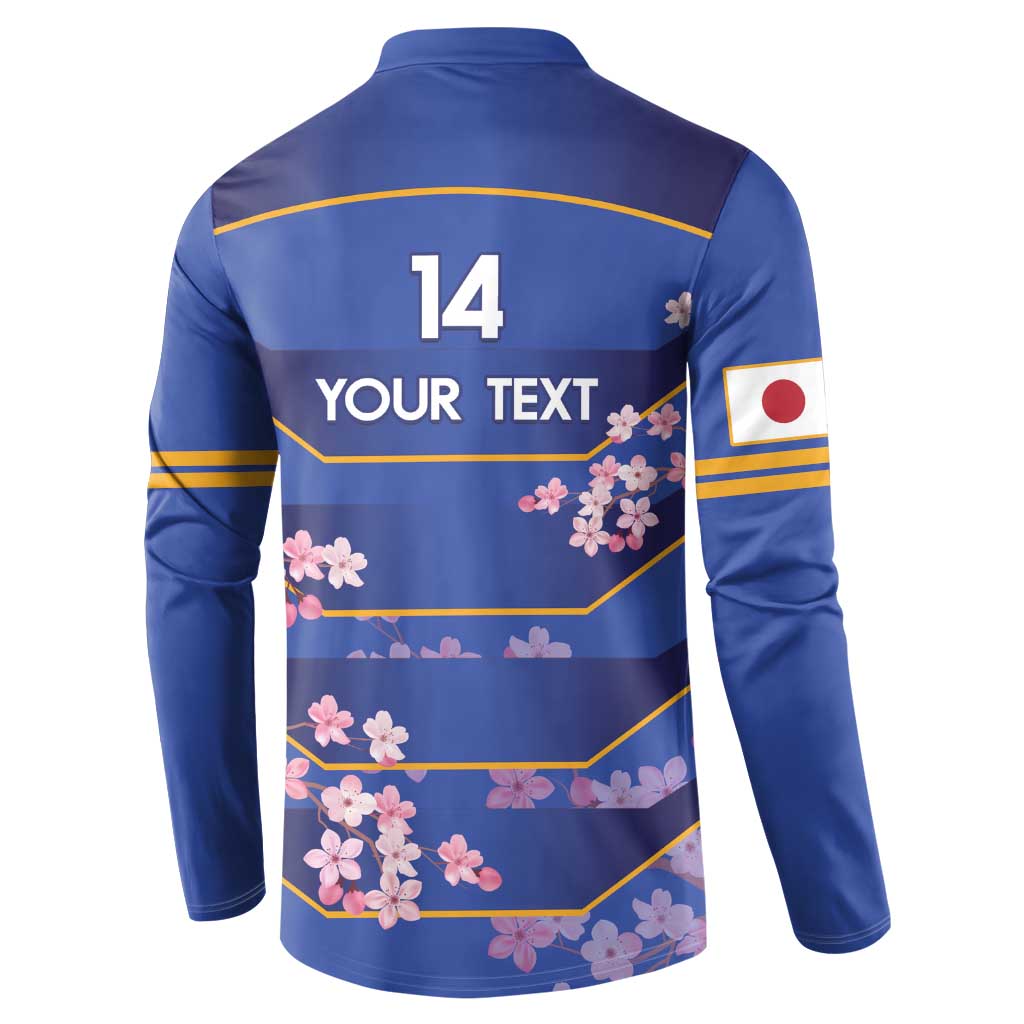 Blue rugby button sweatshirt back with size 14 and yellow-striped cherry blossom print