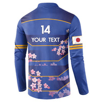 Blue rugby button sweatshirt back with size 14 and yellow-striped cherry blossom print