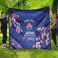 Blue quilt outdoors showing 'YOUR TEXT' and cherry blossoms around the Japan Brave Blossoms