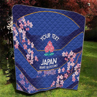 Blue quilt close-up with pink cherry blossoms, 'YOUR TEXT' and Japan Brave Blossoms text