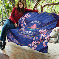 Blue quilt held on couch with pink cherry blossoms and 'YOUR TEXT' Japan Brave Blossoms
