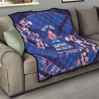 Blue quilt draped on sofa with pink cherry blossoms and 'YOUR TEXT' Japan Brave Blossoms