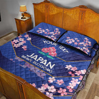 Blue quilt bed set with pink cherry blossoms, “YOUR TEXT,” and two matching pillow covers