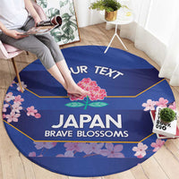 Round blue rug with 'YOUR TEXT' headline and 'JAPAN BRAVE BLOSSOMS' lettering