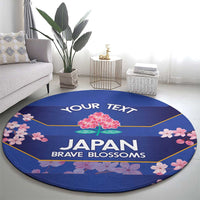 Round blue rug with pink cherry blossoms, 'YOUR TEXT' and 'JAPAN BRAVE BLOSSOMS'