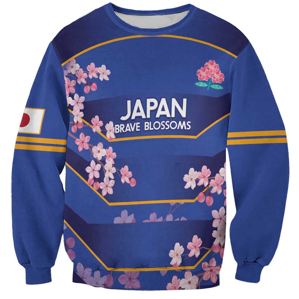 Blue crewneck rugby sweatshirt with Japan Brave Blossoms graphic and pink cherry blossoms
