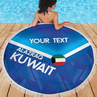 Round blue beach blanket with white fringe, Kuwait flag heart, AL-AZRAQ and KUVWAIT text