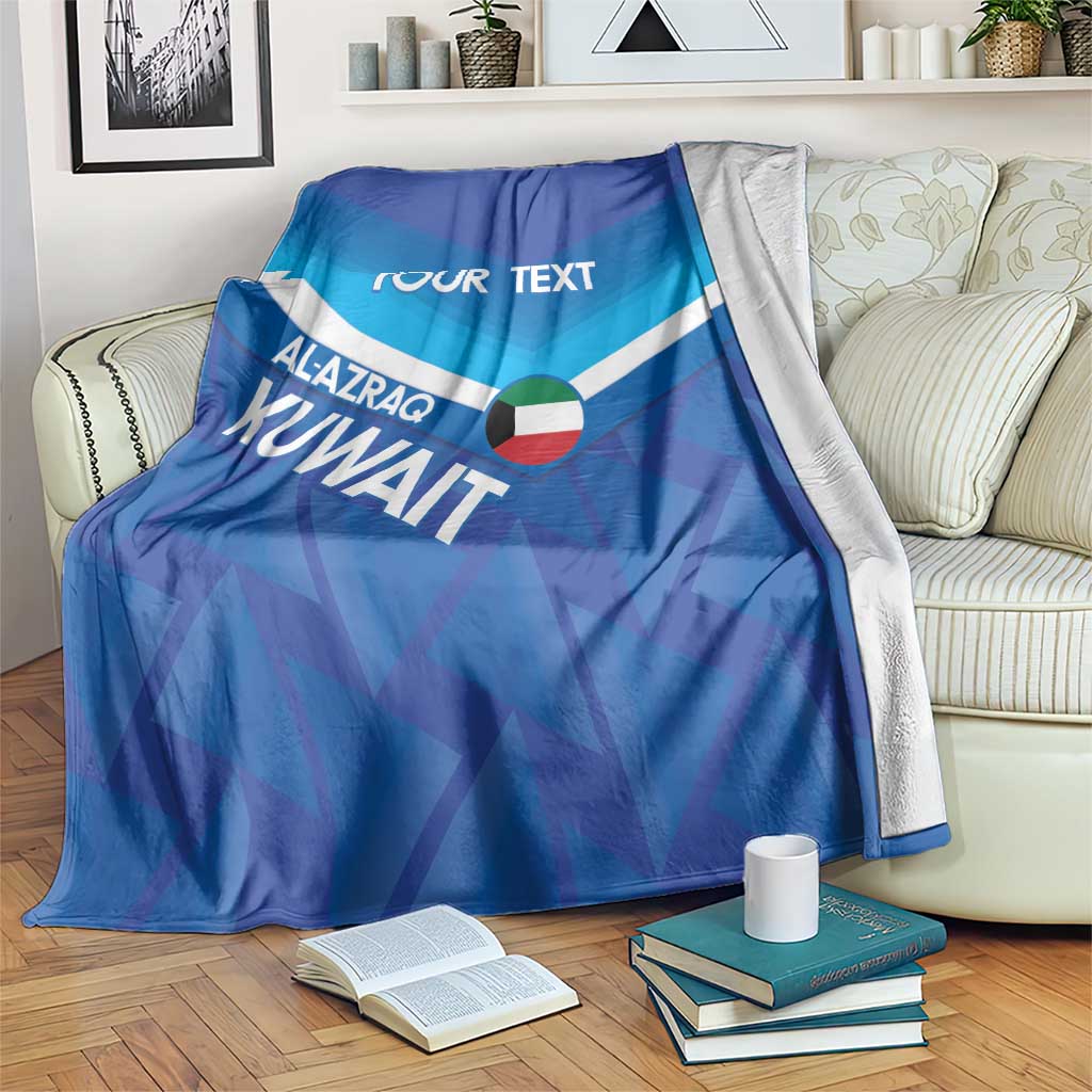 Blue custom football blanket with 'YOUR TEXT' and Alazraq KUNWAIT design, draped over sofa