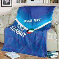 Blue custom football blanket with 'YOUR TEXT' and Kuwait motif, draped on sofa