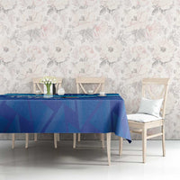Blue football tablecloth on dining table with geometric print and white stripe