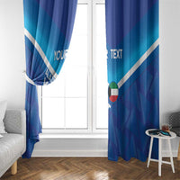 Blue football window curtain panels with white diagonal stripes framing a glass door