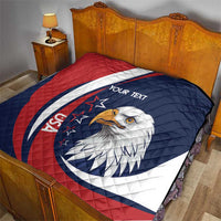 Rugby quilt blanket with navy, red, and white eagle emblem and custom text on bed