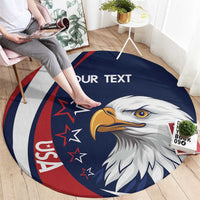 Round blue rug with eagle head artwork, red/white ring, and 'YOUR TEXT' lettering.