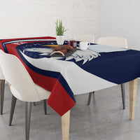 Blue, red and white eagle tablecloth with matching corner overlay on a dining set