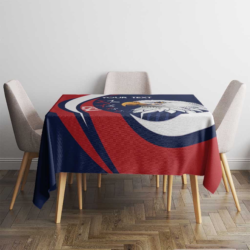 Rectangular eagle sports tablecloth in blue, red, and white on a dining table