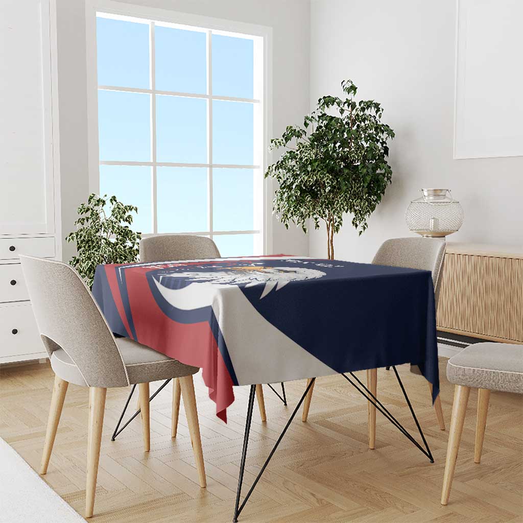 Eagle-themed tablecloth with blue, red, and white print draped over a dining table