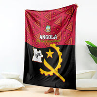 Red and black Angola independence day blanket with geometric pattern and gold emblem