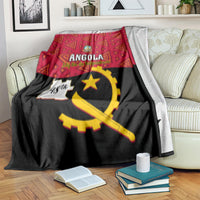 Angola independence day blanket on armchair: red geometric header with gold emblem on black
