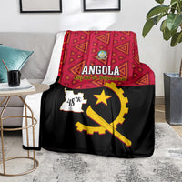 Angola independence day blanket on couch with red pattern, gold star and Angola map graphic