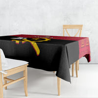 Angola Independence Day tablecloth draped over dark table with red patterned border