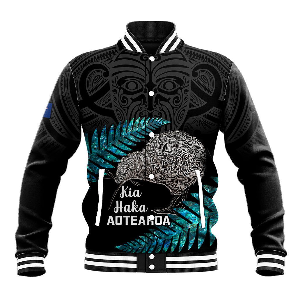 Black varsity baseball jacket with teal kiwi graphic and Kia Haka Aotearoa front print