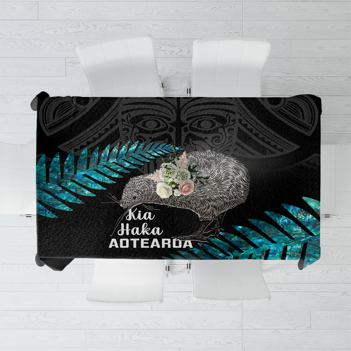 Black rugby tablecloth with teal fern leaf and Kia Haka Aotearoa text