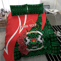 Personalized bedding set with red and green duvet cover featuring emblem and roses, two pillowcases