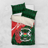Personalized bedding set with red and green duvet cover and matching pillowcases, emblem and roses