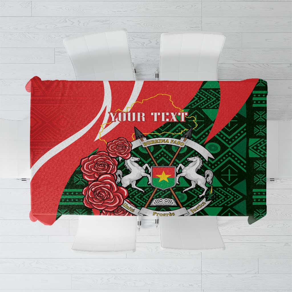 Personalized tablecloth with red top band, green geometric pattern, emblem and roses