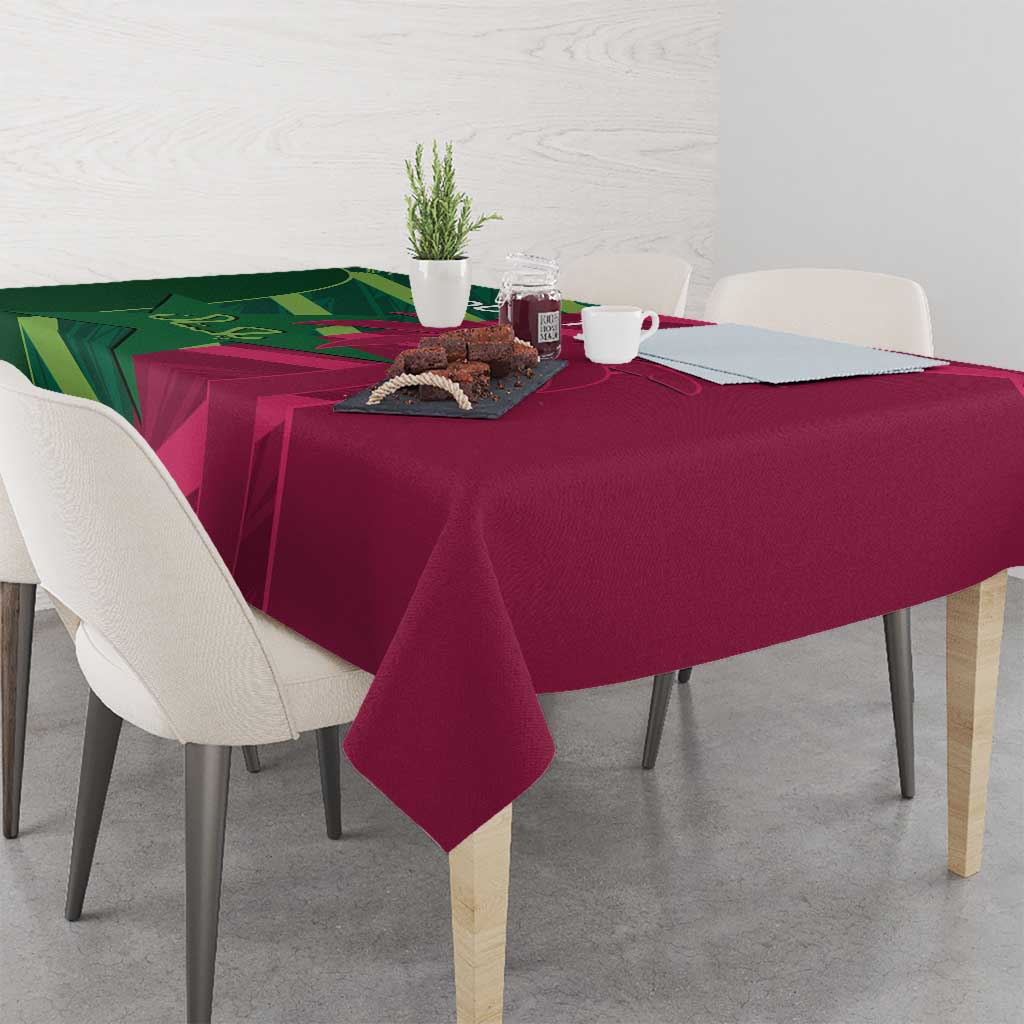 Green and magenta tablecloth with patterned design and corner drapes