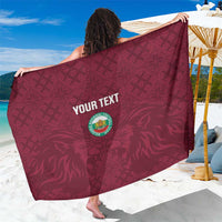 Burgundy football sarong with custom text logo and geometric pattern
