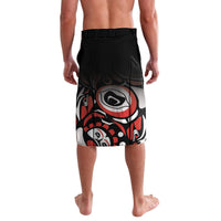 Black graphic board shorts with large red/white face eye motif, elastic waistband