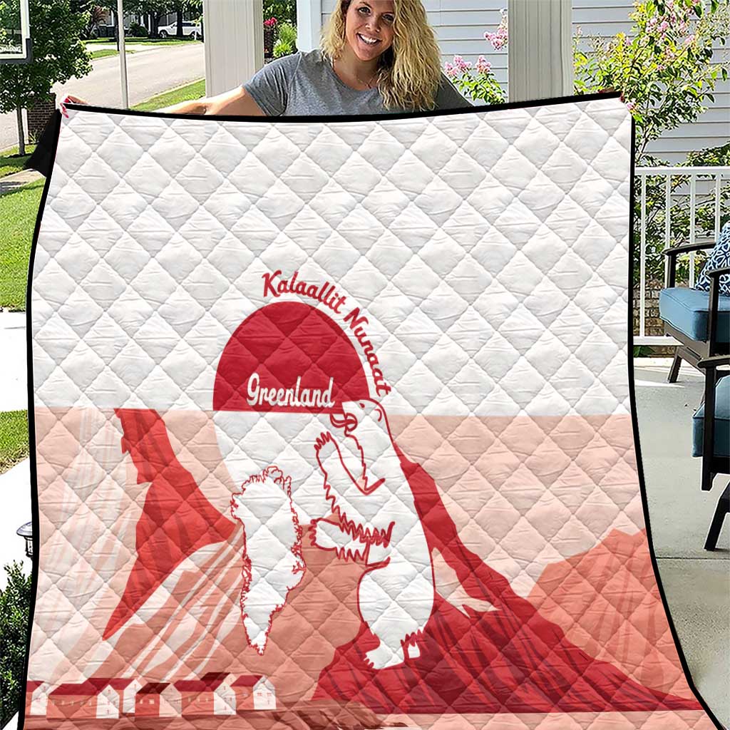 Red and white Greenland flag quilt with diamond stitching and centered crest logo