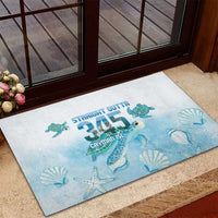 Blue rubber doormat with sea turtle and sea-shell watercolor graphic, rectangular