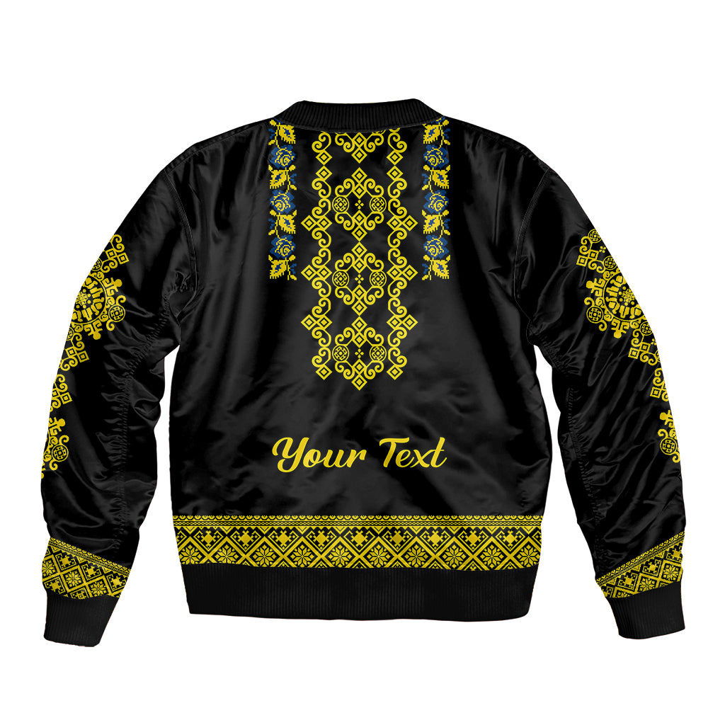 Black bomber jacket back with yellow and blue folk pattern and 'Your Text'
