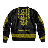 Black bomber jacket back with yellow and blue folk pattern and 'Your Text'