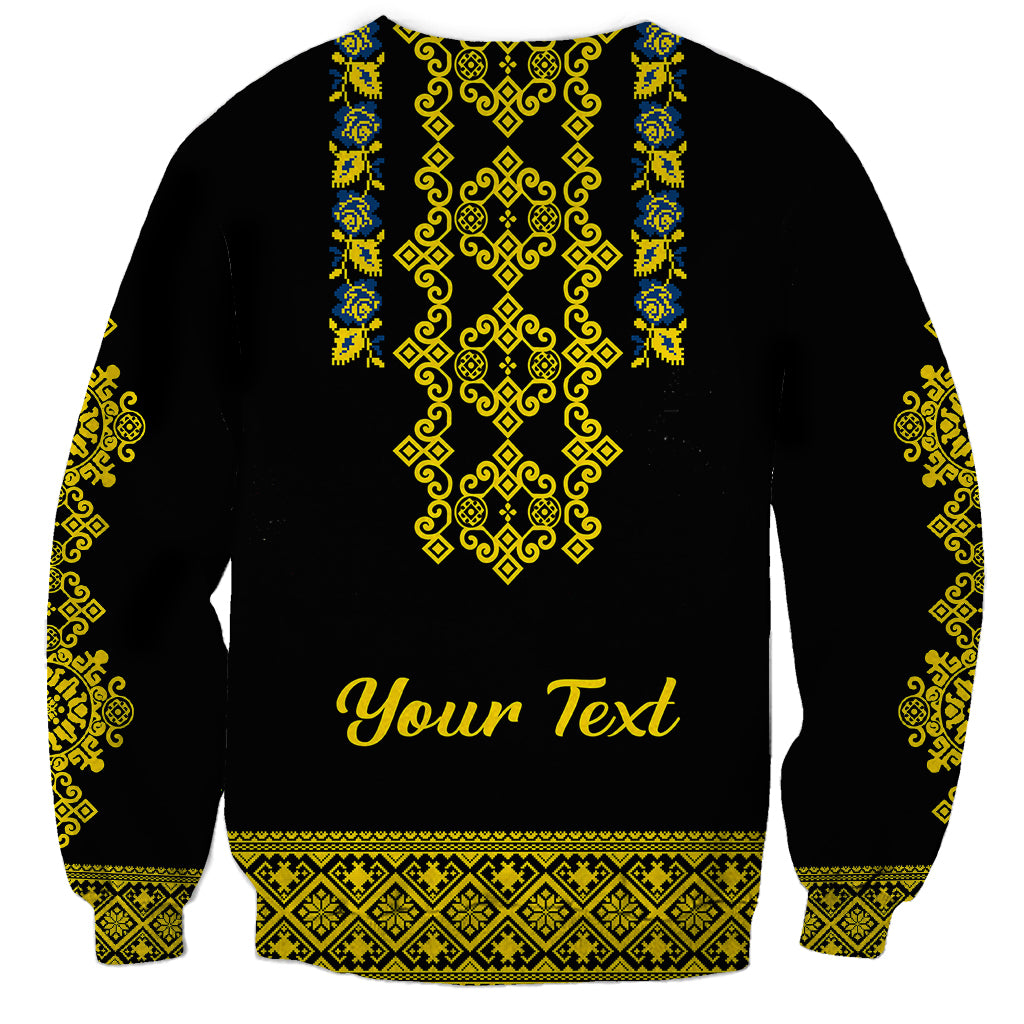 Black sweatshirt with Ukrainian folk pattern and "Your Text" graphic on front