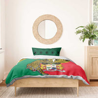 Green red yellow duvet on wooden bed with leopard coat of arms and geometric edge trim