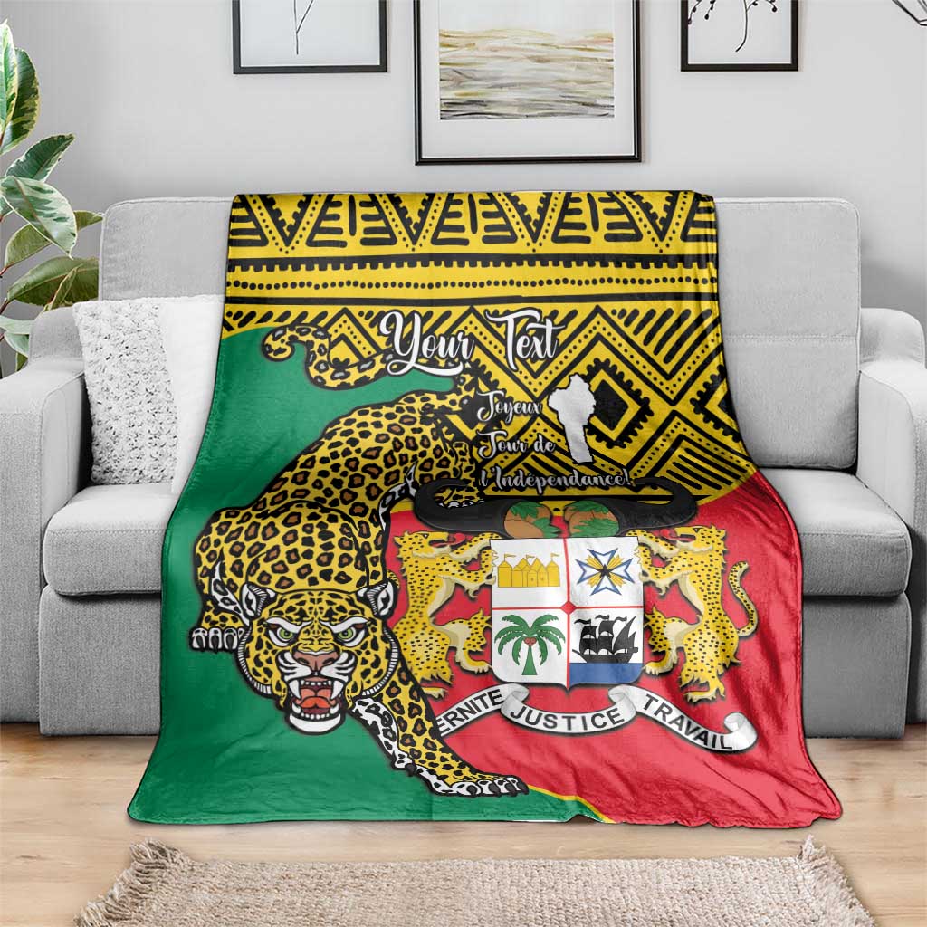 Leopard coat-of-arms Benin national day blanket draped on sofa, green red yellow.