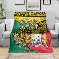 Leopard coat-of-arms Benin national day blanket draped on sofa, green red yellow.
