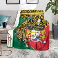 Leopard coat-of-arms Benin blanket on bedspread, green red and yellow flag-style design.