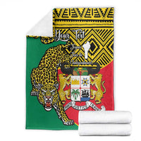 Benin national day blanket with coat of arms and leopard pattern, green red and yellow.
